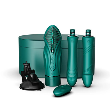 Starting from left, is a standing, slightly angled right view of the Suction Cup Base, alongside a front upside down standing view of the Zalo Sesh Compact Sex Machine - Turquoise Green, then an upside down standing view of Attachment 1 , and finally on the far right is Attachment 2 also on a front upside down standing view. The Remote Control for the vibe lays flat in front of and in between the vibe and Attachment 1, whilst the Luxury Leather Storage Case sits on its base behind all the contents listed above.